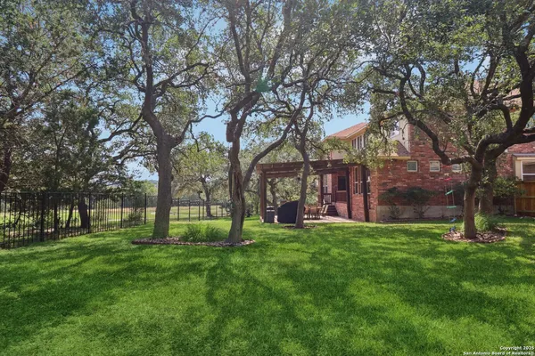 a view of a tree in front of a house
