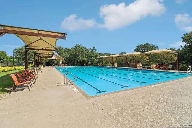 a view of swimming pool with seating area