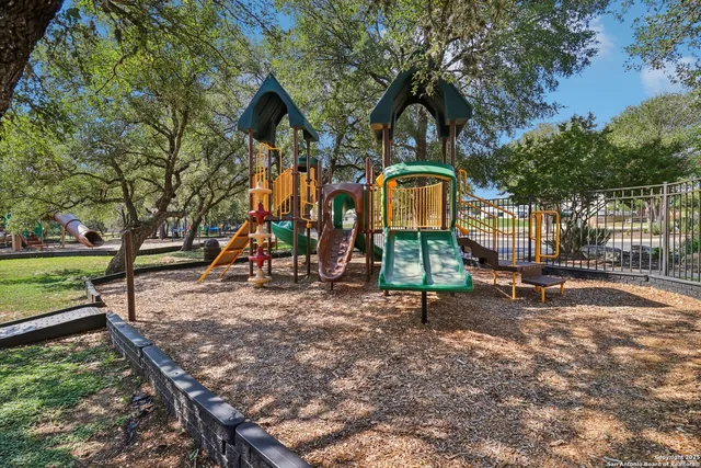 a park with bench and trees