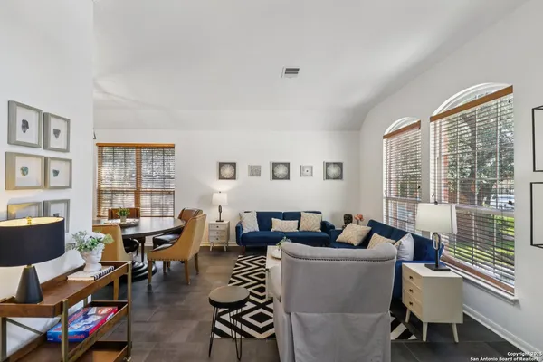 a living room with furniture and a window