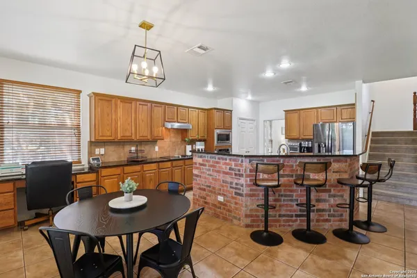 a view of a dining room with furniture and window