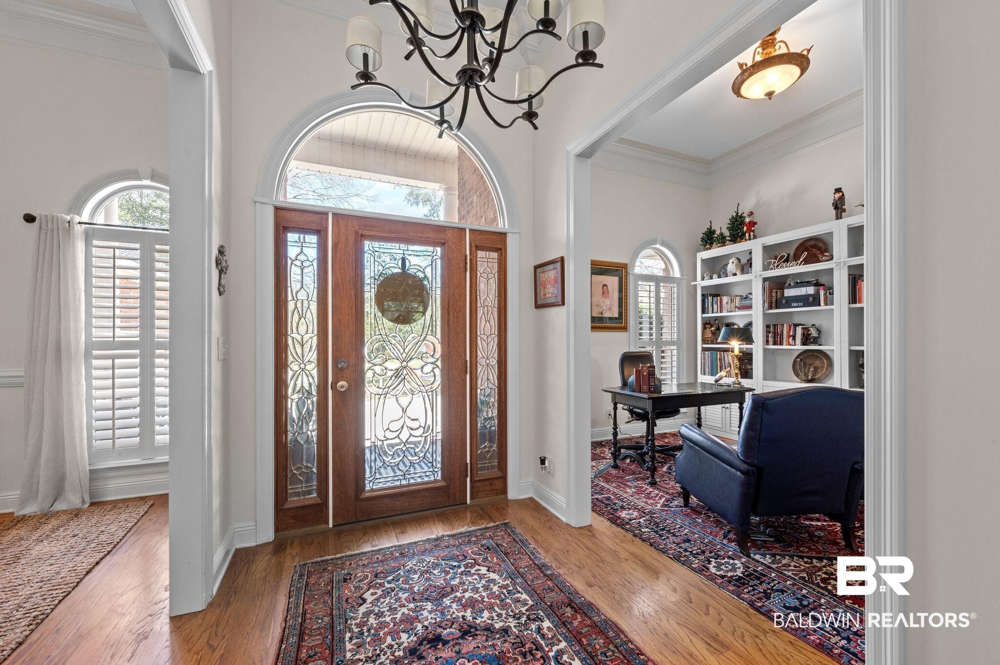 30151 Dolive Ridge Daphne, AL 36527 - Photo 3 of 37 Entrance foyer featuring plenty of natural light, an inviting chandelier, wood finished floors, and crown molding
