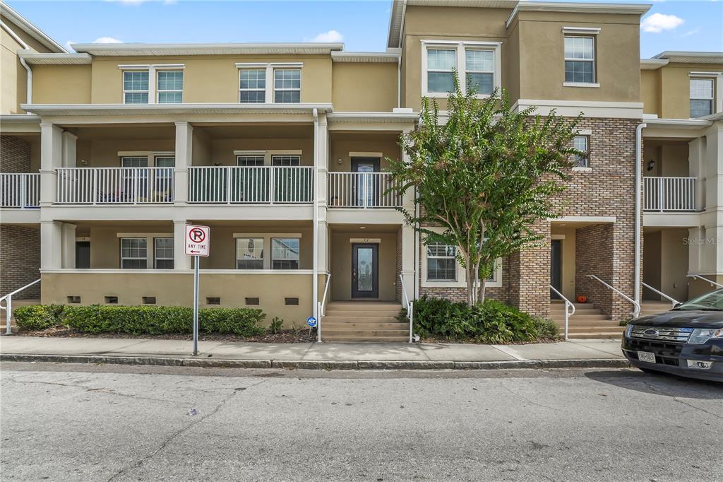 a view of a car parked in front of a building