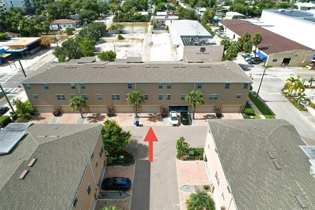 an aerial view of a house with outdoor space