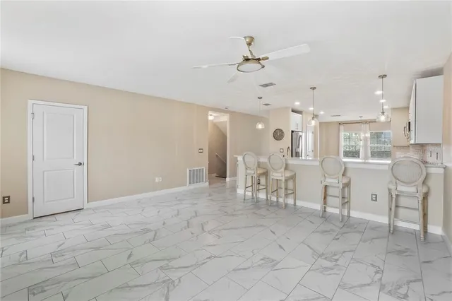a view of a livingroom with furniture and a chandelier