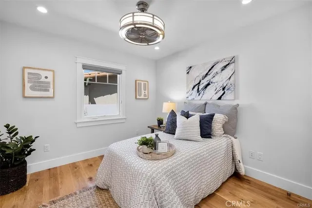 a bed room with a bed and a chair