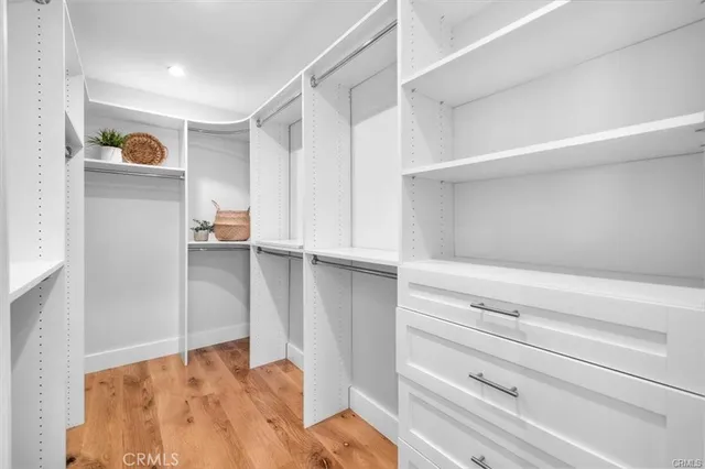 a spacious bathroom with a double vanity sink mirror and shower