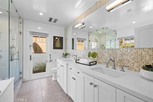 a bathroom with a tub and shower