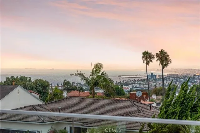 a front view of house with backyard and garden