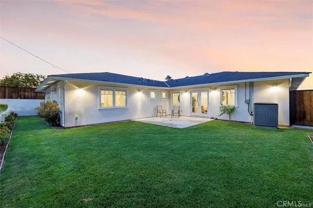 an aerial view of a house with a swimming pool