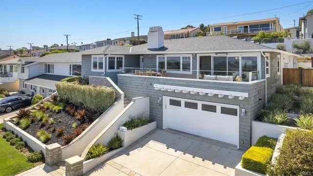 an aerial view of residential building and ocean