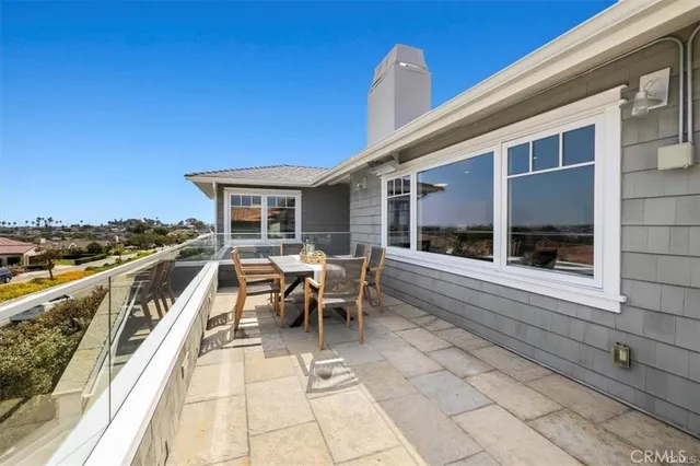 a bathroom with a sink a toilet and a large mirror