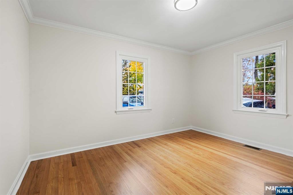 238 Springfield Avenue, Unit 1 Rutherford, NJ 07070 - Photo 12 of 33 an empty room with a window