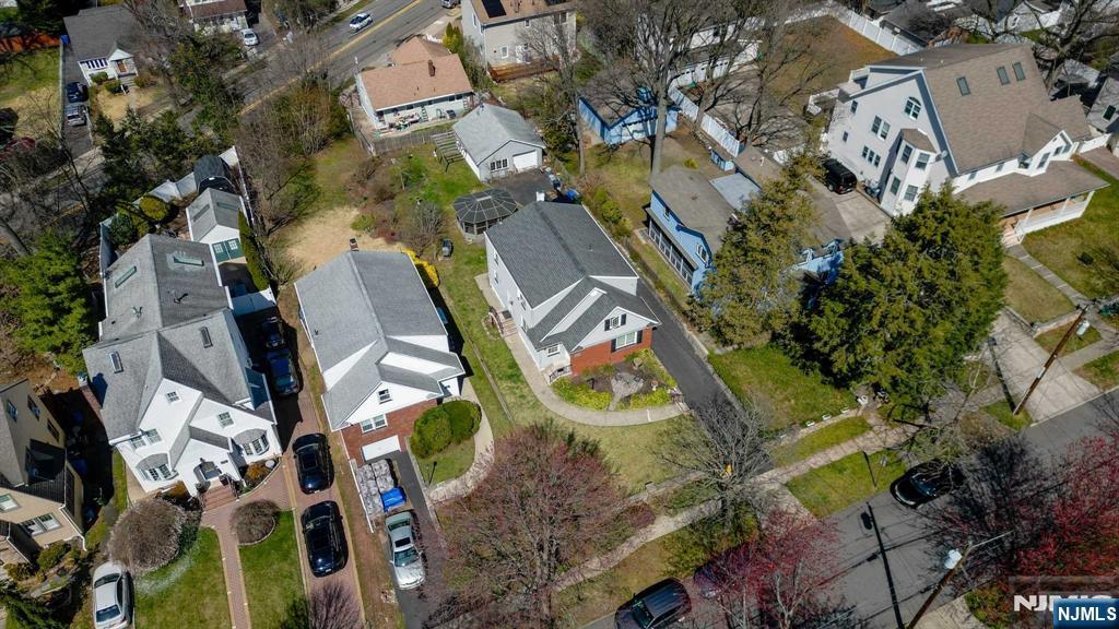 238 Springfield Avenue, Unit 1 Rutherford, NJ 07070 - Photo 30 of 33 an aerial view of a house with a yard and outdoor seating