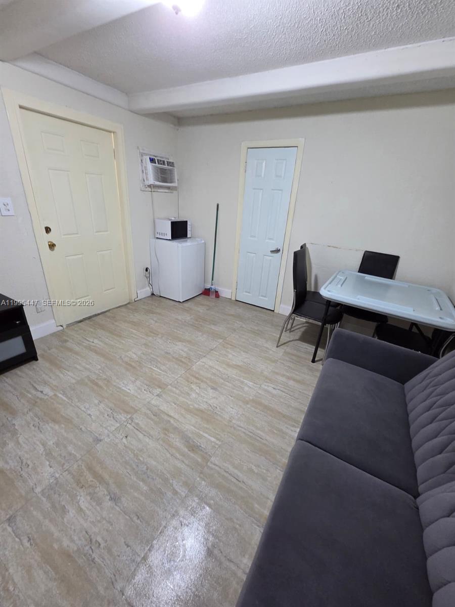 1420 Southwest 129th Court, Unit 1 Miami, FL 33184 - Photo 3 of 11 a living room with furniture and a wooden floor