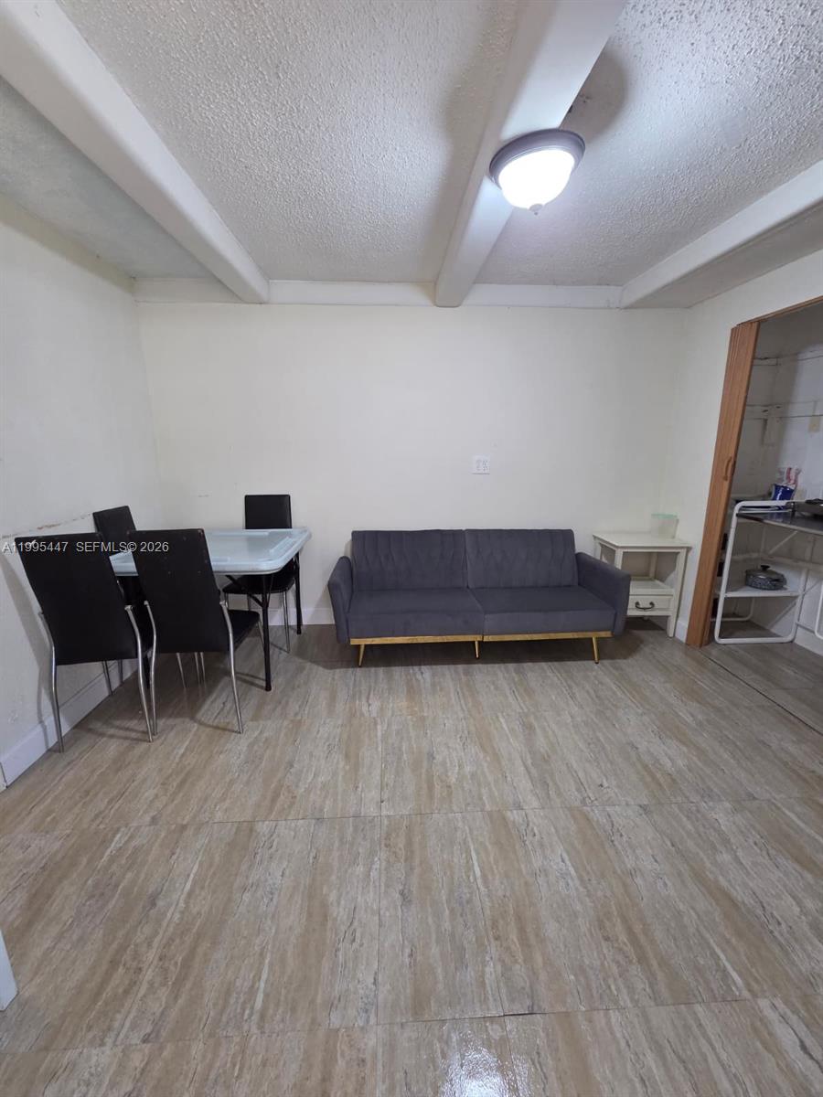 1420 Southwest 129th Court, Unit 1 Miami, FL 33184 - Photo 6 of 11 a living room with furniture