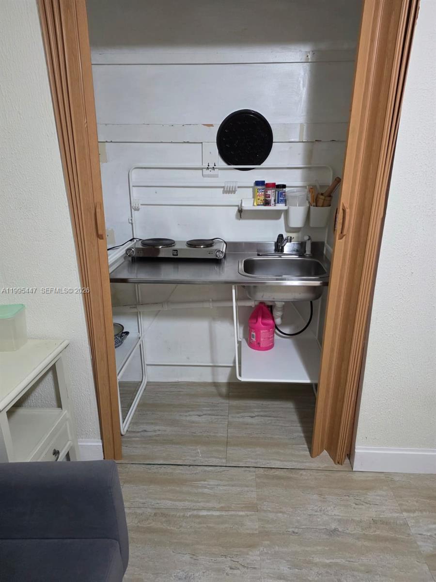 1420 Southwest 129th Court, Unit 1 Miami, FL 33184 - Photo 7 of 11 a view of a room with wooden floor