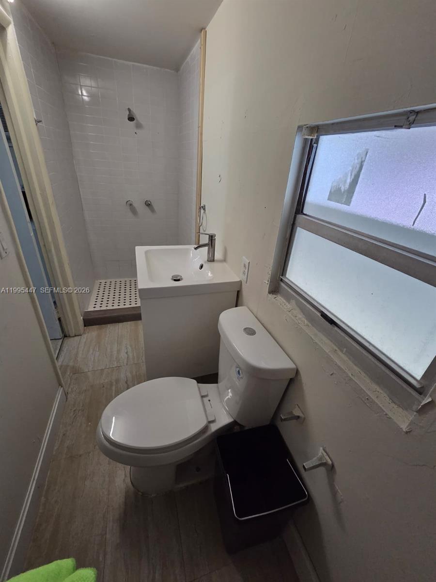 1420 Southwest 129th Court, Unit 1 Miami, FL 33184 - Photo 9 of 11 a bathroom with a toilet and a sink
