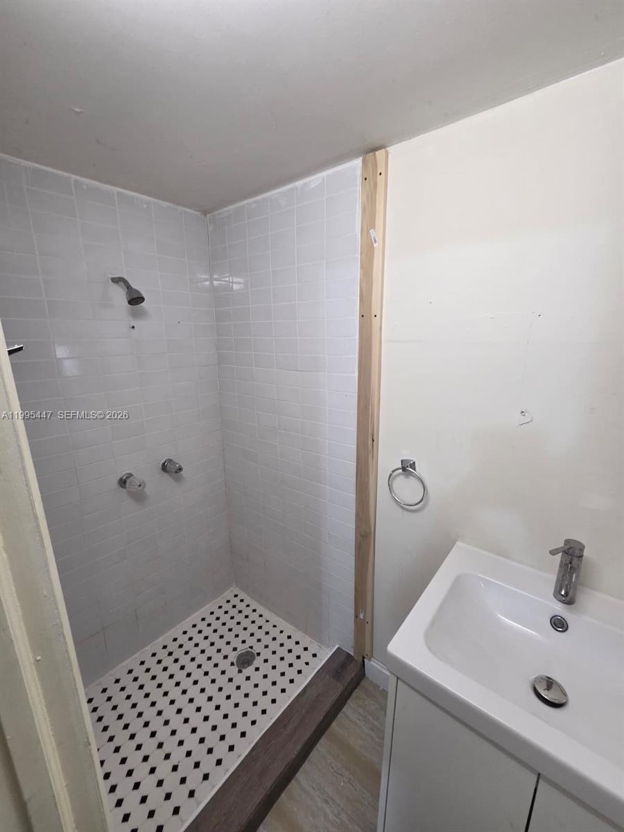1420 Southwest 129th Court, Unit 1 Miami, FL 33184 - Photo 10 of 11 a bathroom with a sink and a shower