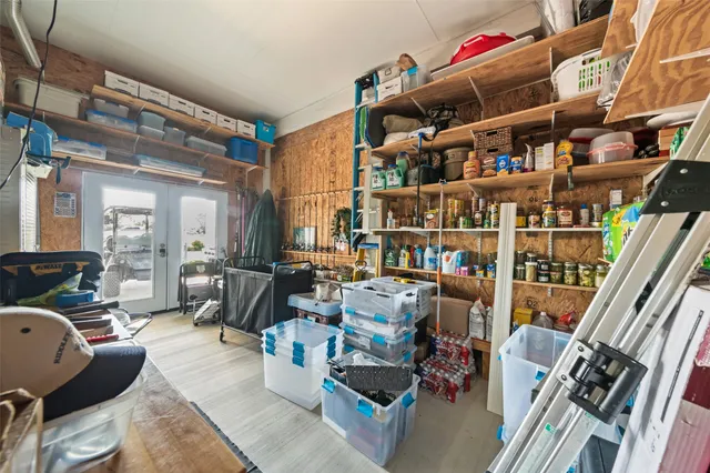 a living room with lots of furniture and a book shelf