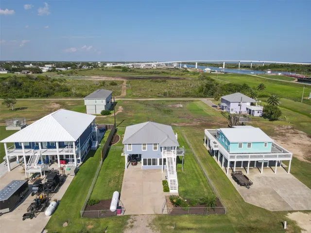 an aerial view of a house with a lake view