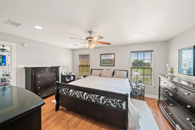 a bedroom with a bed and a dresser