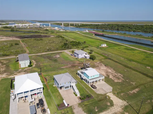 an aerial view of a house with a ocean view