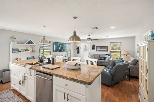 a very nice looking living room with a large window and furniture