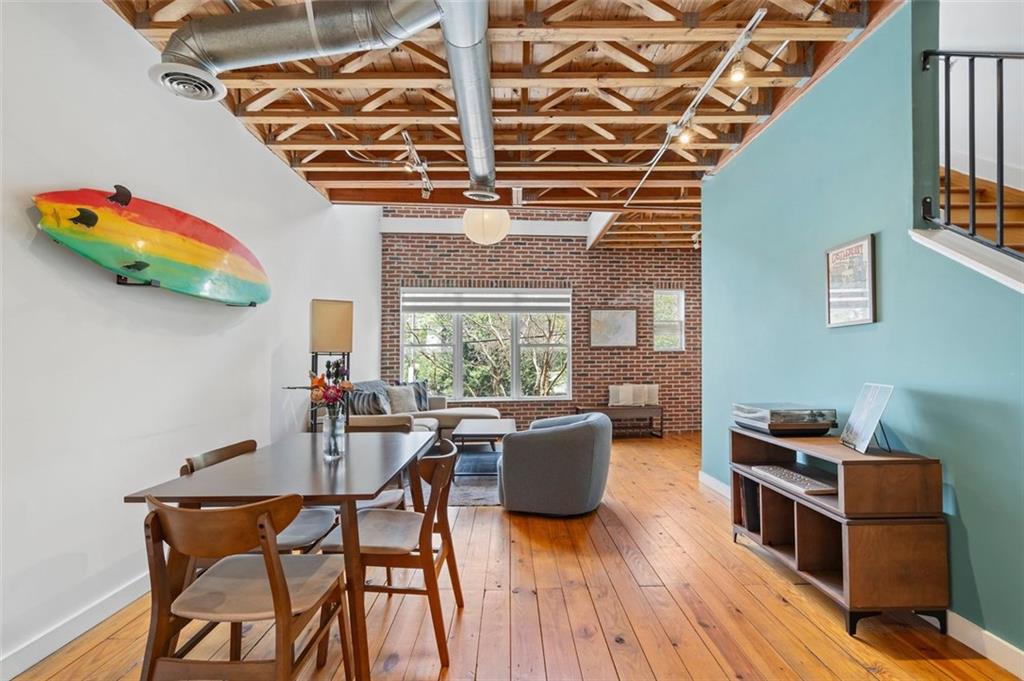322 Peters Street Southwest, Unit 2 Atlanta, GA 30313 - Photo 1 of 58 a living room with furniture and a wooden floor
