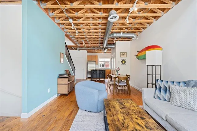 a view of a dining room with furniture and wooden floor