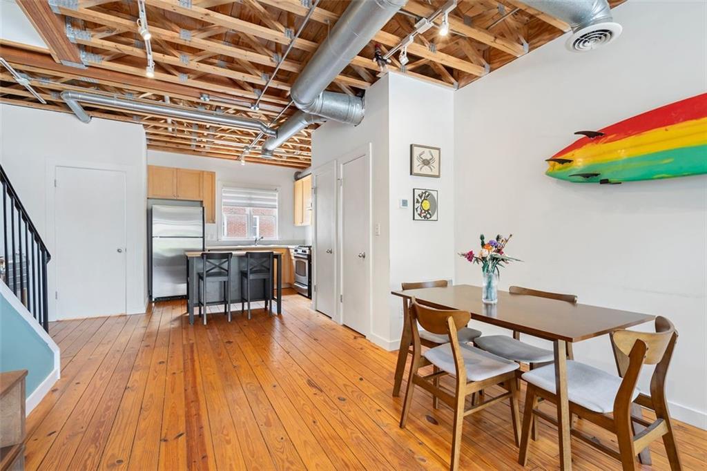 322 Peters Street Southwest, Unit 2 Atlanta, GA 30313 - Photo 13 of 58 a dining room with furniture and wooden floor