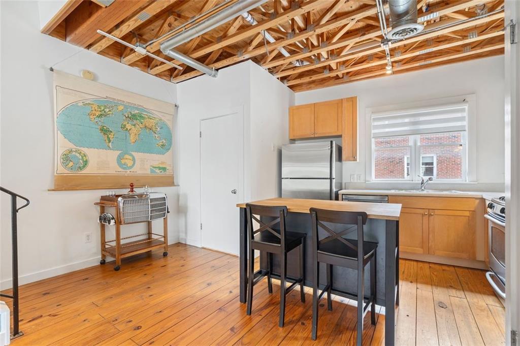 322 Peters Street Southwest, Unit 2 Atlanta, GA 30313 - Photo 15 of 58 a dining room with furniture and wooden floor
