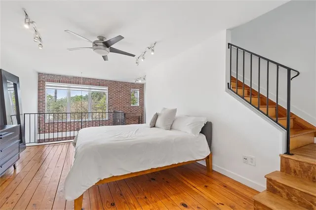 a bathroom with a double vanity sink a toilet and shower