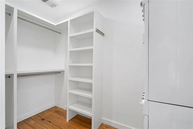 a view of a wooden deck with a yard