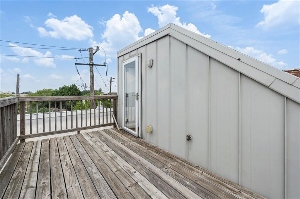 322 Peters Street Southwest, Unit 2 Atlanta, GA 30313 - Photo 34 of 58 a view of a wooden deck with a yard