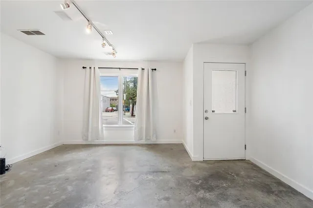 a front view of a building with a road