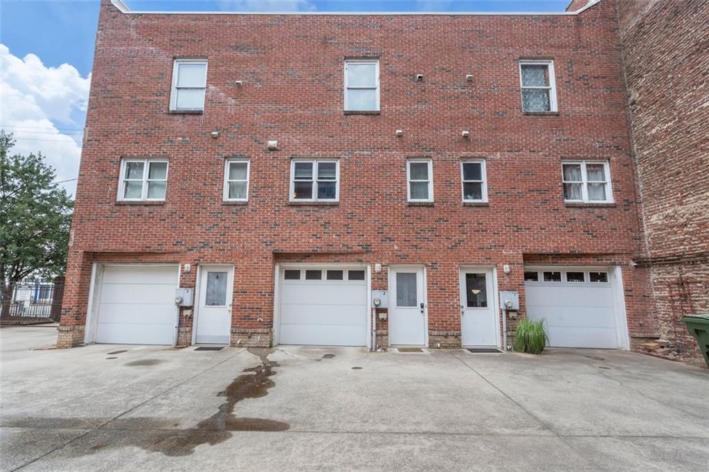 322 Peters Street Southwest, Unit 2 Atlanta, GA 30313 - Photo 40 of 58 a front view of a building with a parking area