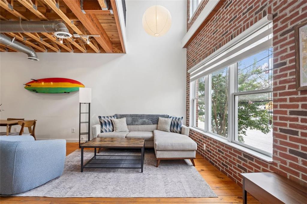 322 Peters Street Southwest, Unit 2 Atlanta, GA 30313 - Photo 4 of 58 a bedroom with furniture and a large window