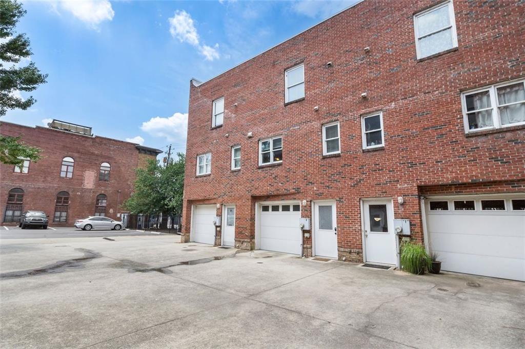 322 Peters Street Southwest, Unit 2 Atlanta, GA 30313 - Photo 41 of 58 a front view of a building with a road