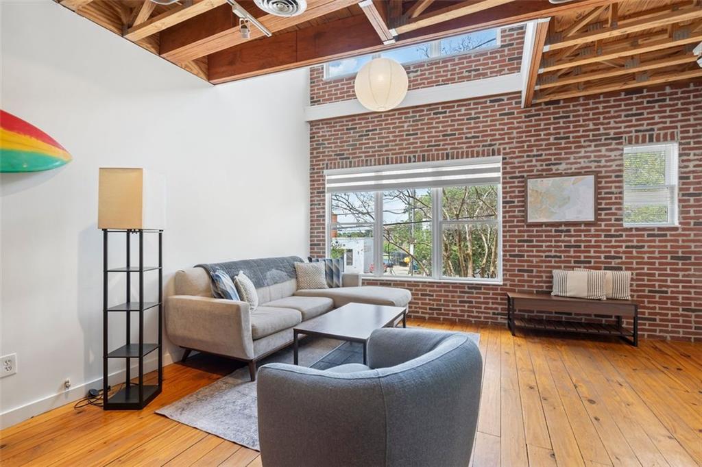322 Peters Street Southwest, Unit 2 Atlanta, GA 30313 - Photo 7 of 58 a living room with furniture and a fireplace
