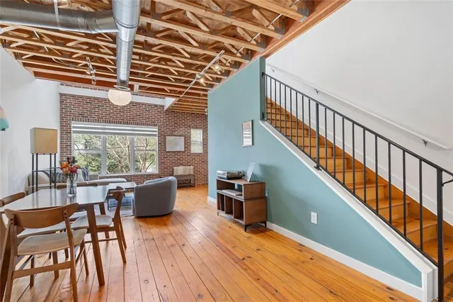 a view of a dining room with furniture window and wooden floor