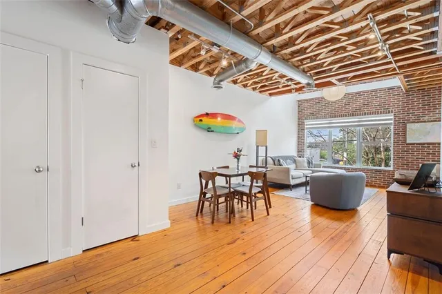 a dining room with a table and chairs
