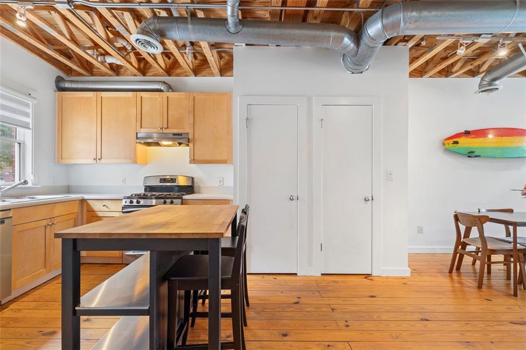 322 Peters Street Southwest, Unit 2 Atlanta, GA 30313 - Photo 10 of 58 a dining room with a table and chairs