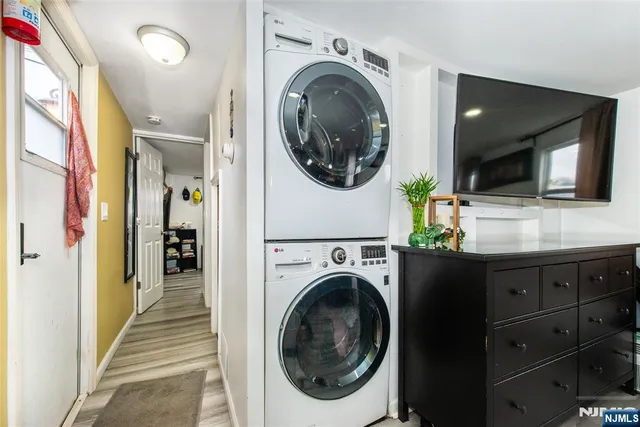 a view of a hallway with washer and dryer