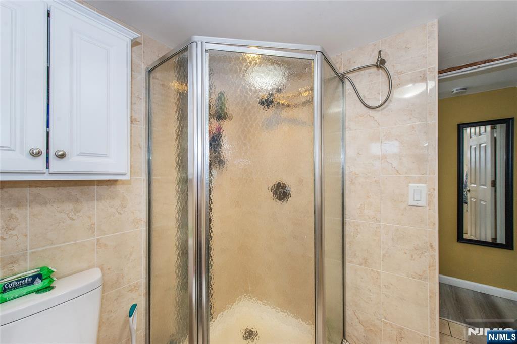 39 Helen Drive Moonachie, NJ 07074 - Photo 19 of 20 a bathroom with a glass shower door