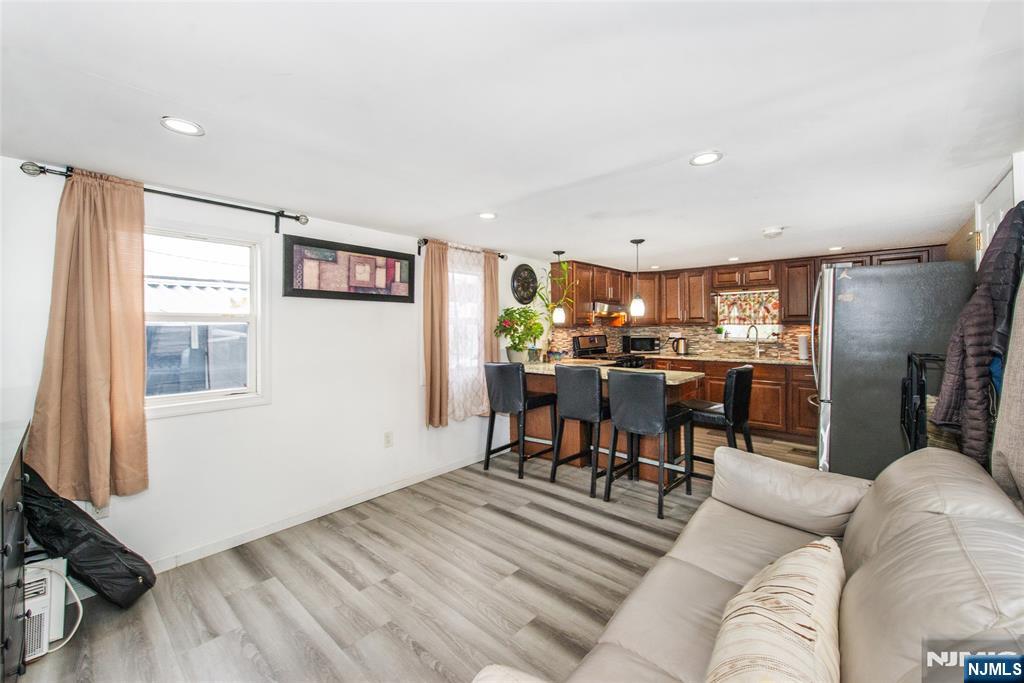 39 Helen Drive Moonachie, NJ 07074 - Photo 7 of 20 a living room with furniture and a window