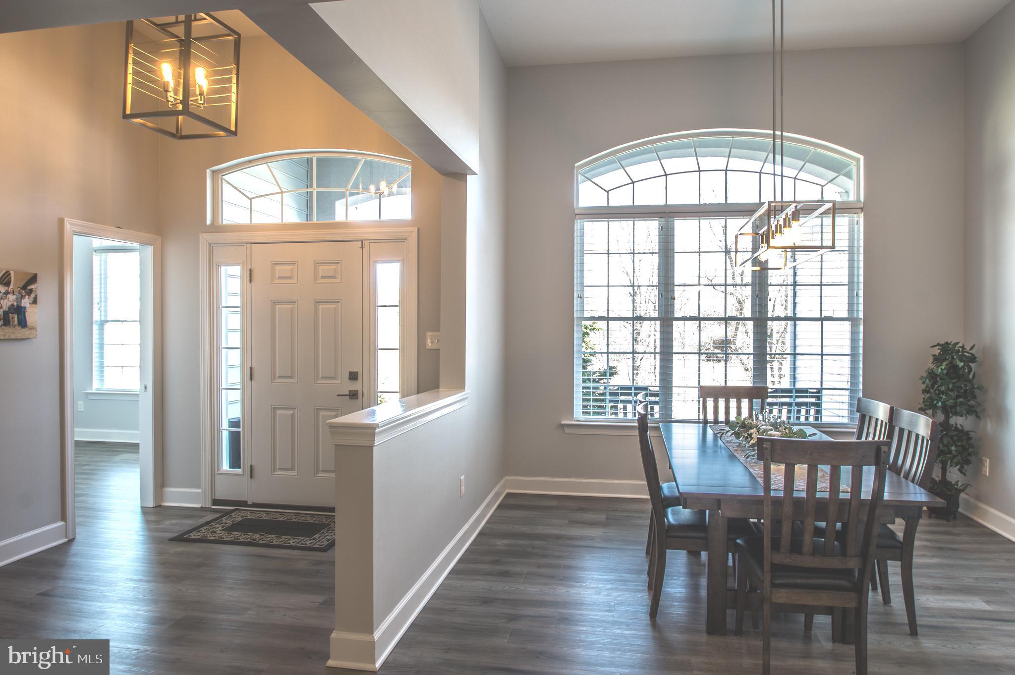 105 Quartz Ridge Road Hanover, PA 17331 - Photo 21 of 51 a view of a dining room with furniture window and wooden floor