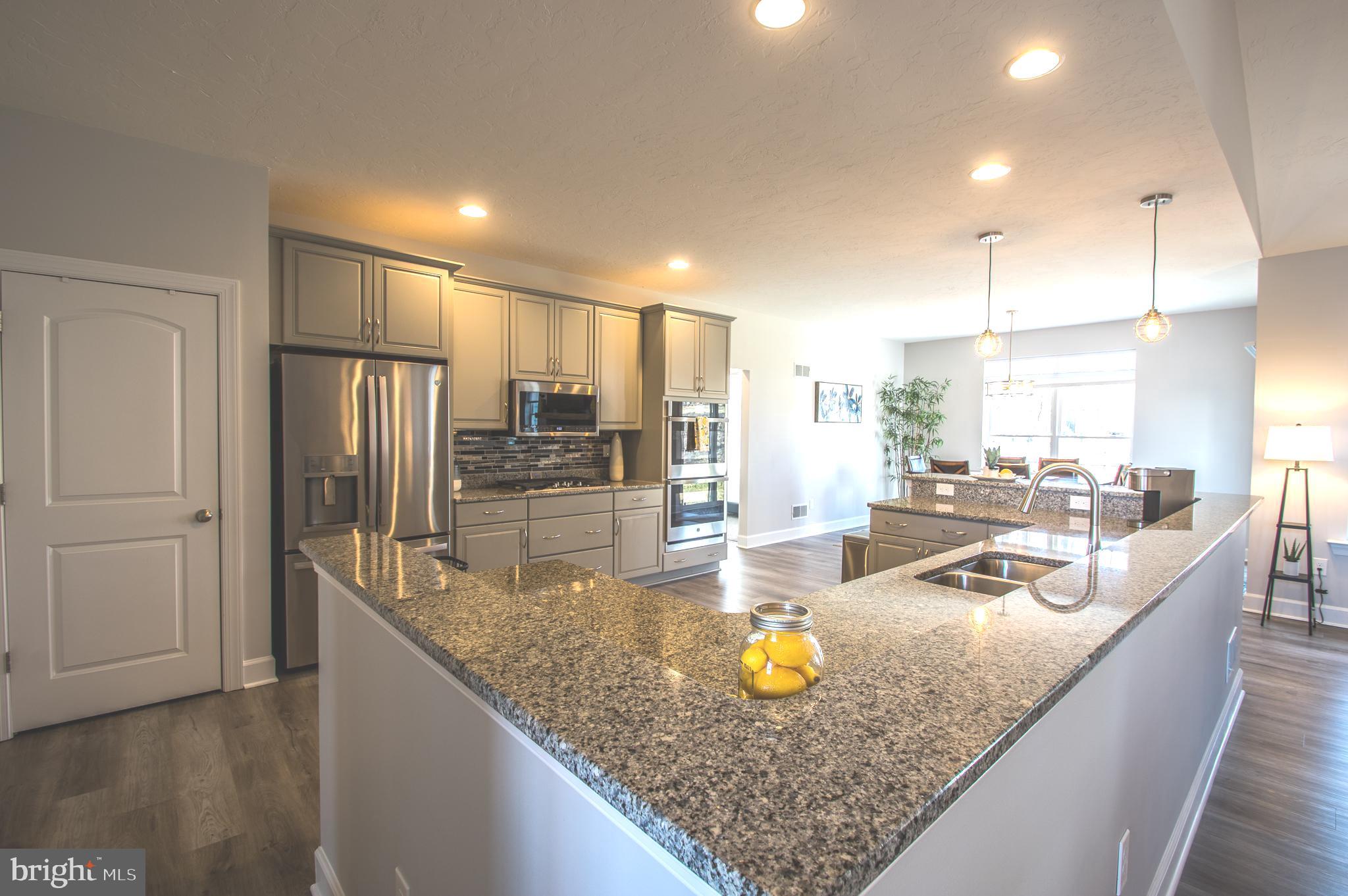 105 Quartz Ridge Road Hanover, PA 17331 - Photo 23 of 51 a kitchen with stainless steel appliances granite countertop a sink refrigerator and cabinets
