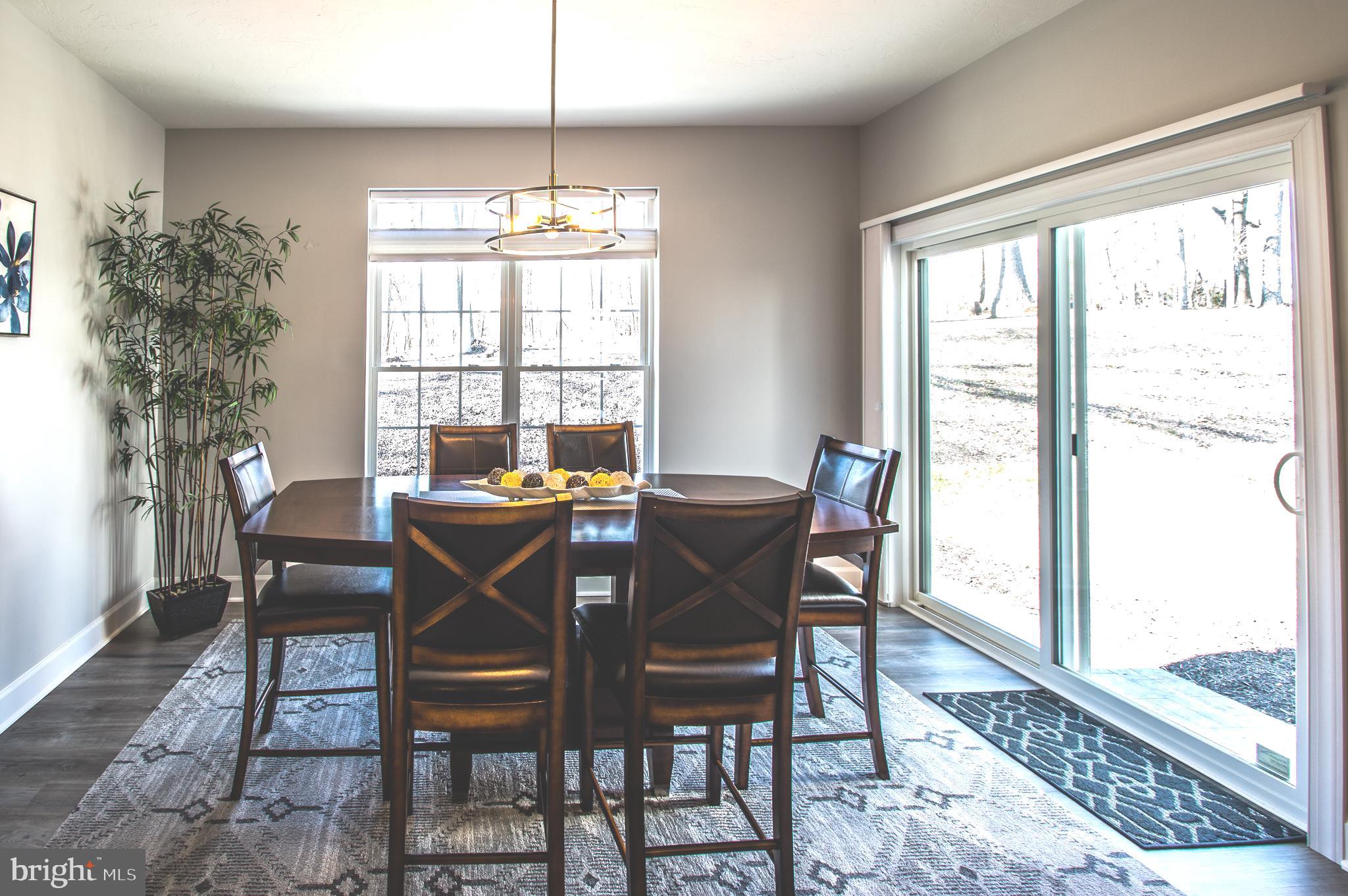 105 Quartz Ridge Road Hanover, PA 17331 - Photo 28 of 51 a view of a dining room with furniture window and wooden floor
