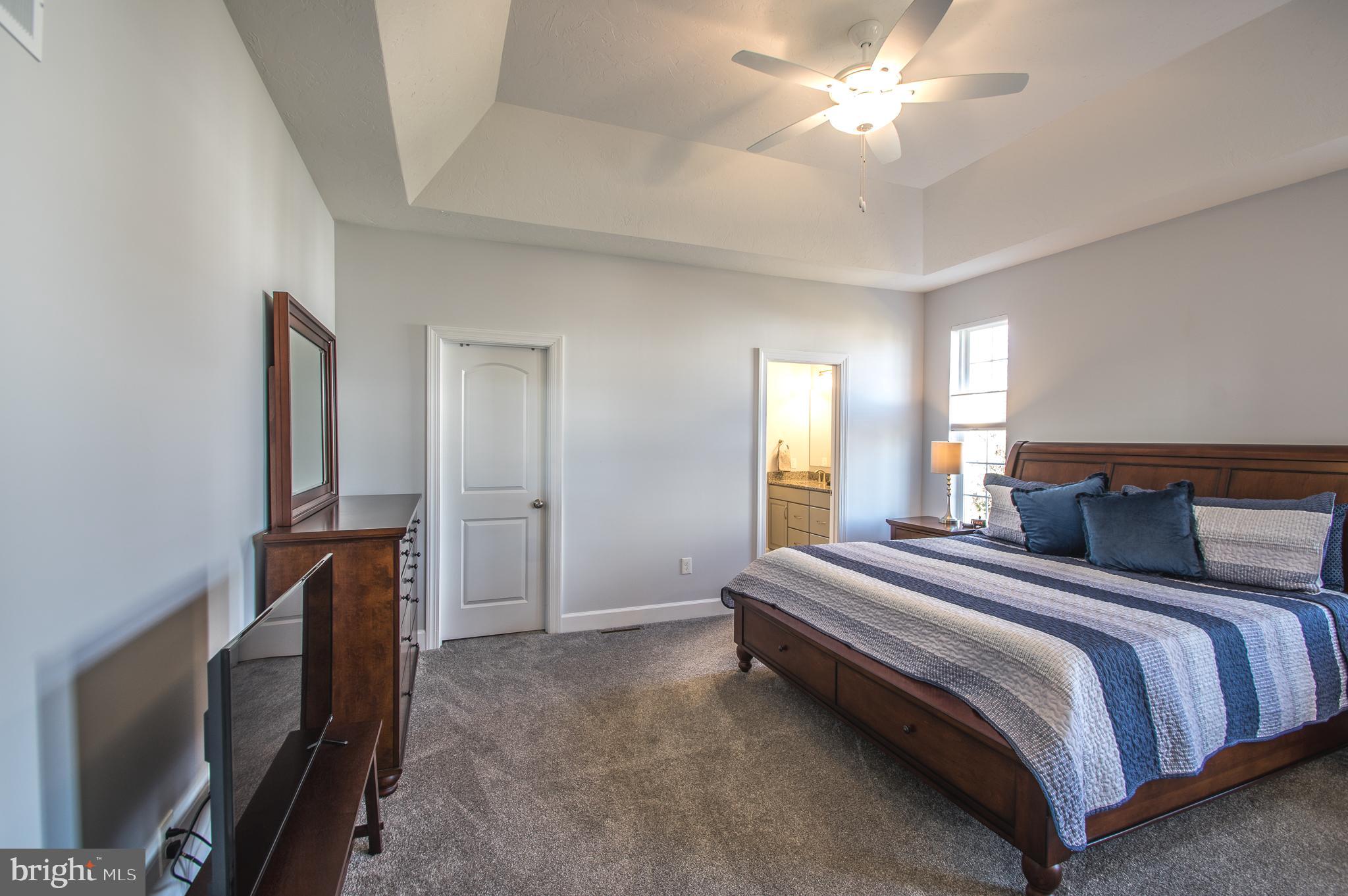 105 Quartz Ridge Road Hanover, PA 17331 - Photo 32 of 51 a spacious bedroom with a bed and a chandelier